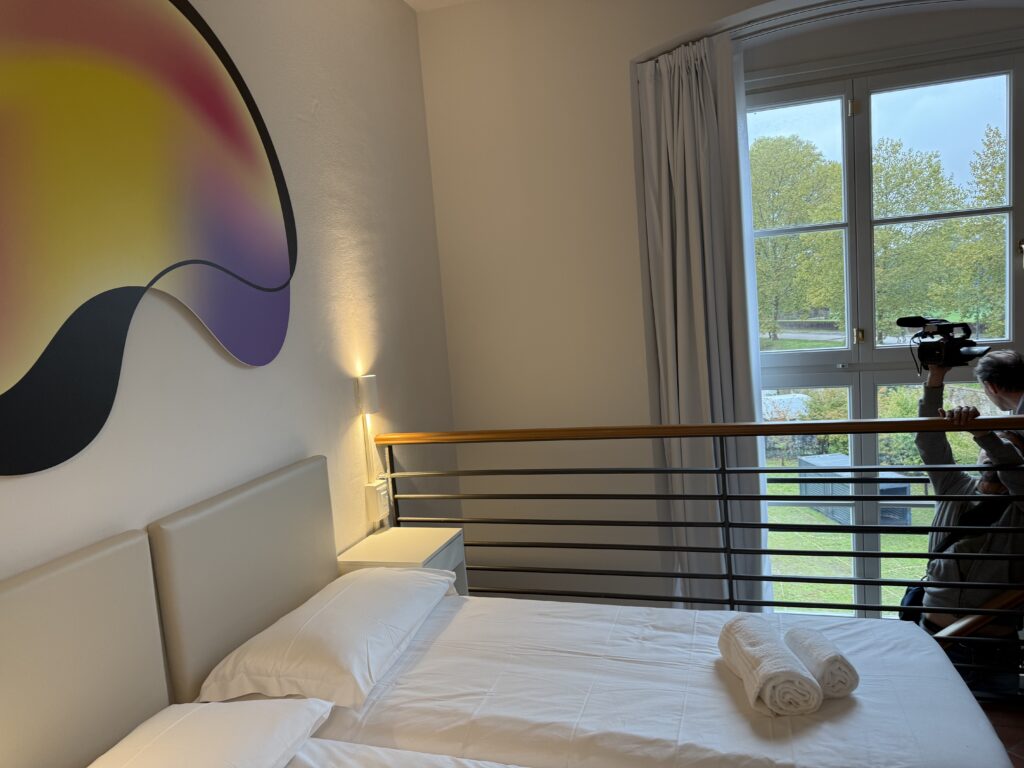 THE VIEW FROM ONE OF THE HOSTEL'S APARTMENTS, FEATURES LUCCA HISTORIC WALLS.